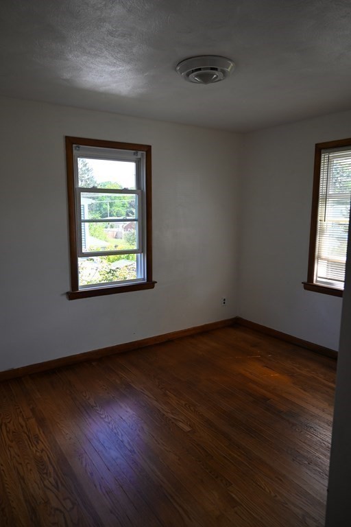 16 Charles Hill Road Holyoke, MA 01040 - Photo 15 of 27 an empty room with wooden floor and windows