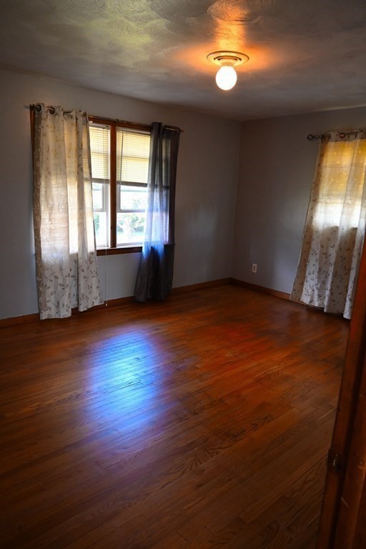 16 Charles Hill Road Holyoke, MA 01040 - Photo 17 of 27 an empty room with wooden floor and windows