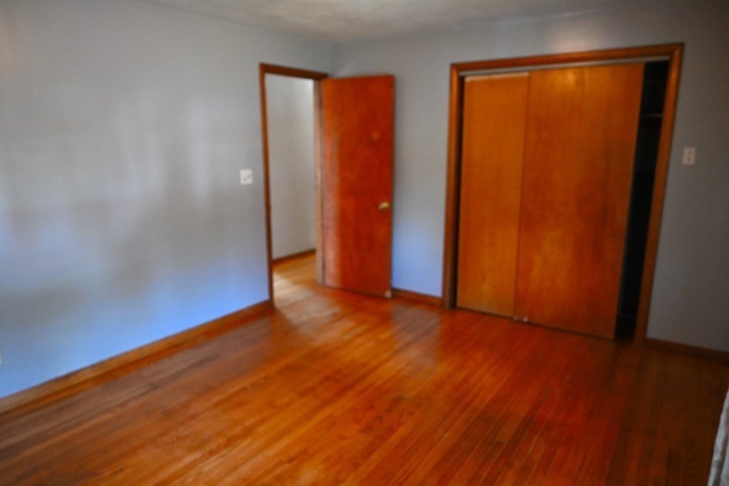 16 Charles Hill Road Holyoke, MA 01040 - Photo 18 of 27 an empty room with wooden floor and closet