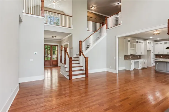 a view of entryway and hall with wooden floor
