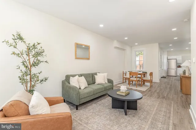 a living room with furniture and a table