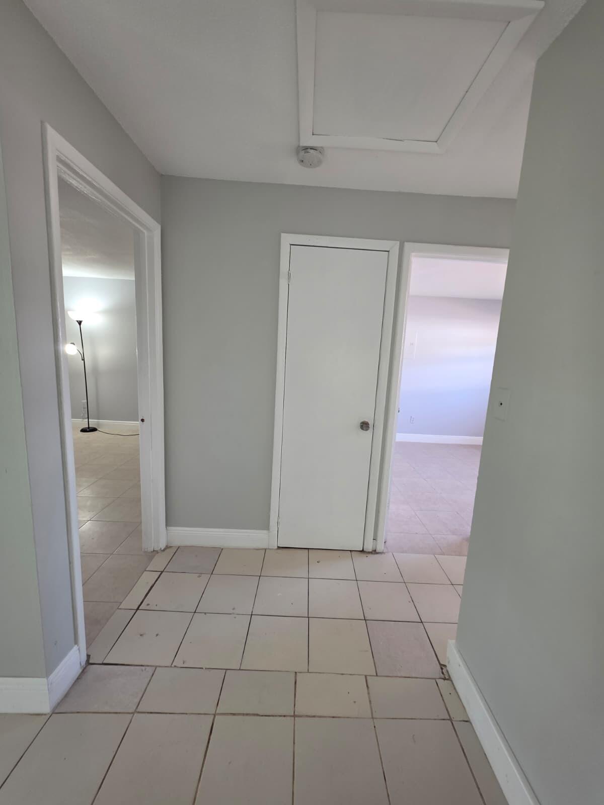 3386 Rudolph Road Lake Worth Beach, FL 33461 - Photo 20 of 25 a view of a livingroom with an empty space and wooden floor