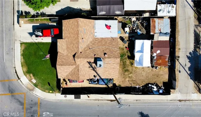 an aerial view of a house with a yard