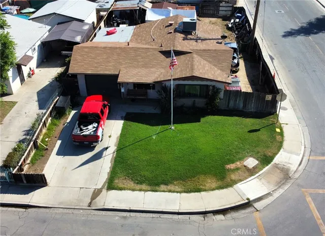 an aerial view of a house with a swimming pool