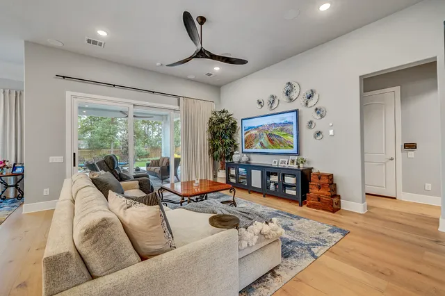 a large kitchen with a table and chairs