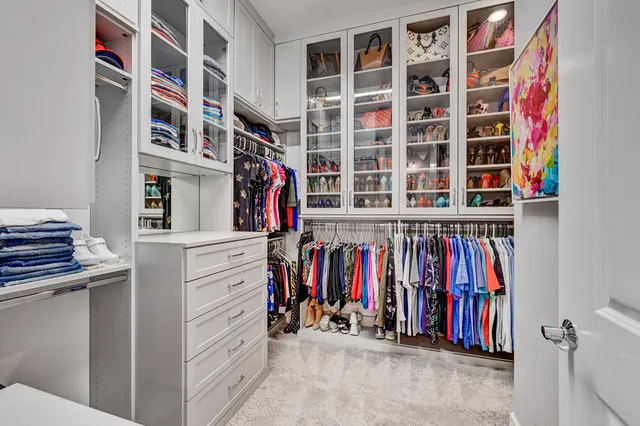 a view of a patio with chairs and table in a yard