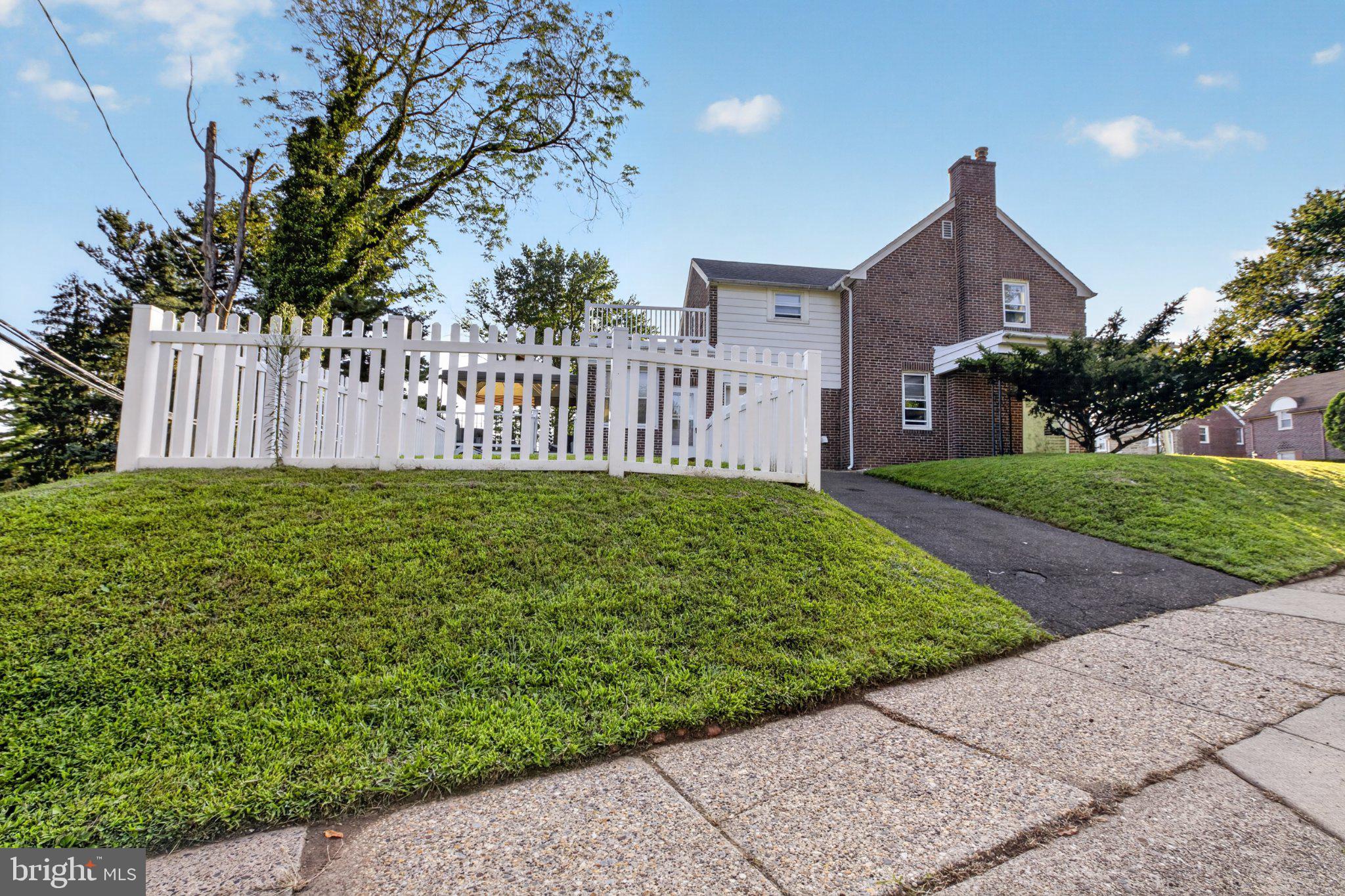 16 Underwood Road Wyncote, PA 19095 - Photo 38 of 40 Charming brick home with white fence.