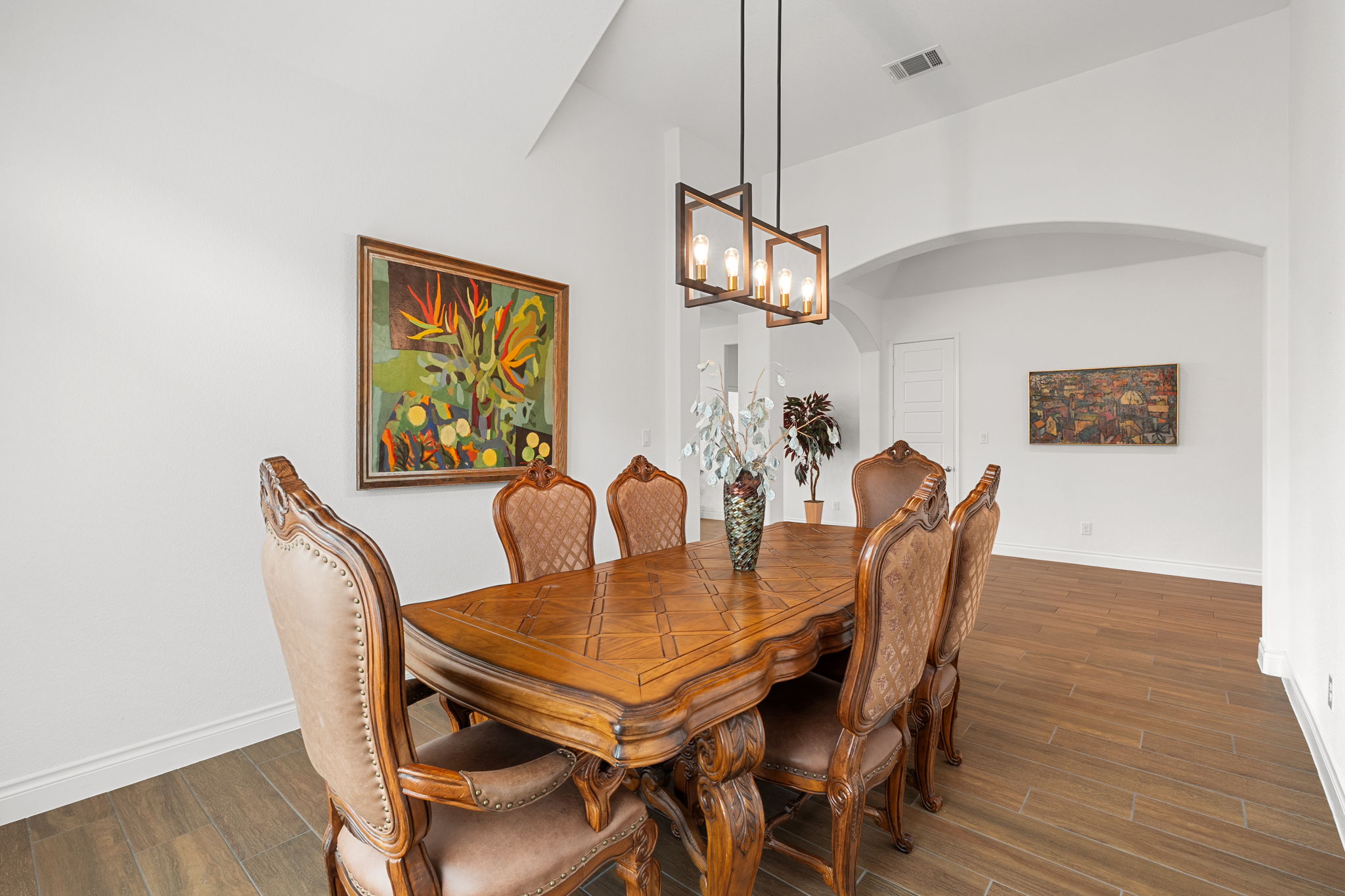 1908 Woolsey Way Leander, TX 78641 - Photo 10 of 36 A spacious dining room features vaulted ceilings, custom lighting and an arched entry.