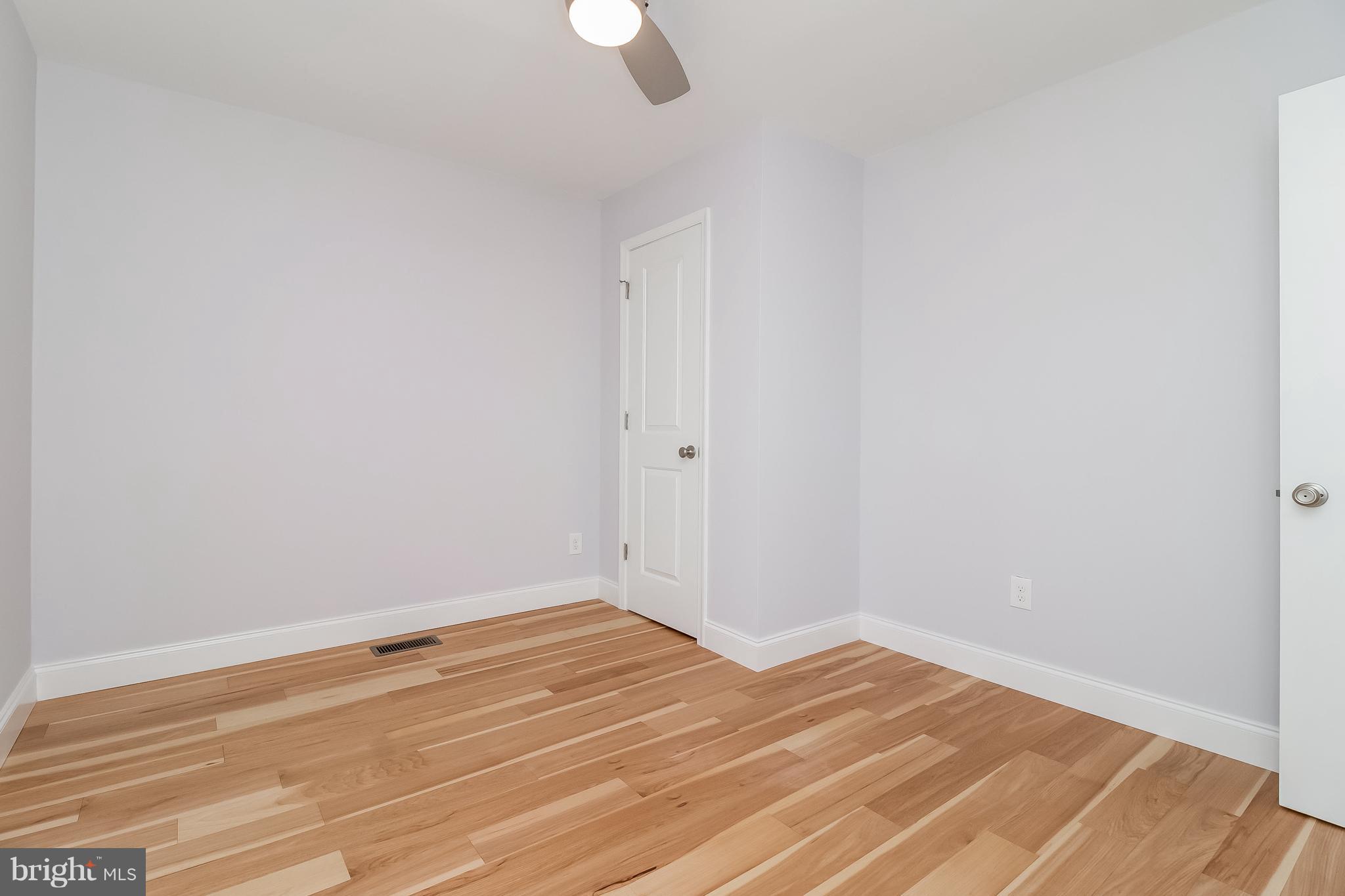 17 State Road, Unit B Media, PA 19063 - Photo 12 of 19 a view of a room with wooden floor and white walls