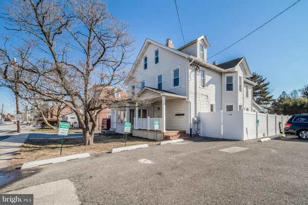 a view of a pathway besides a house