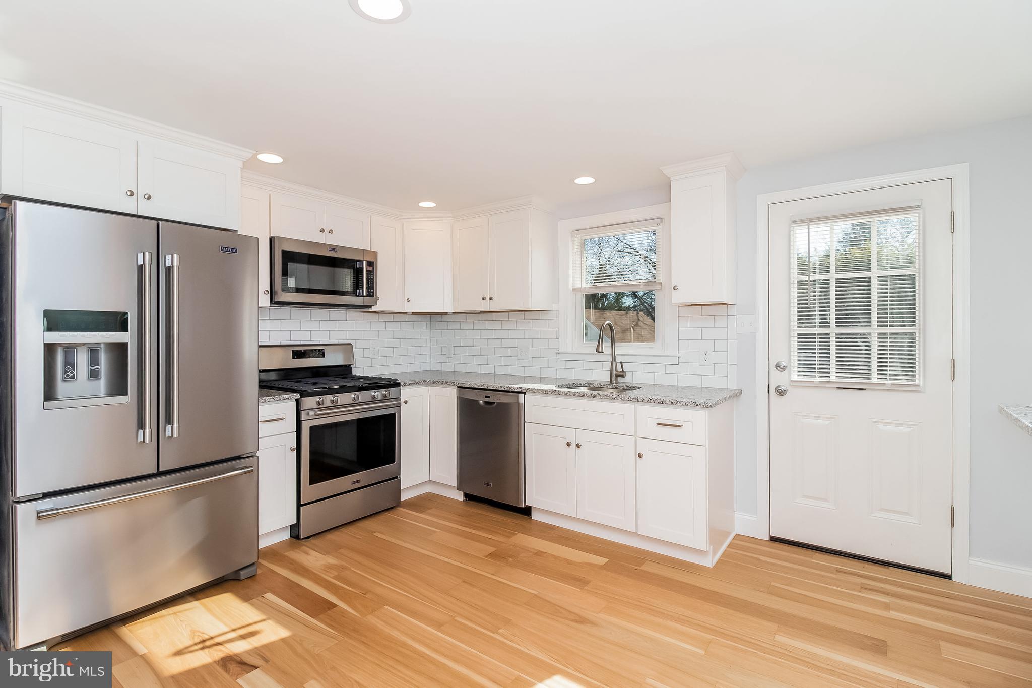 17 State Road, Unit B Media, PA 19063 - Photo 4 of 19 a kitchen with granite countertop a refrigerator stove and sink