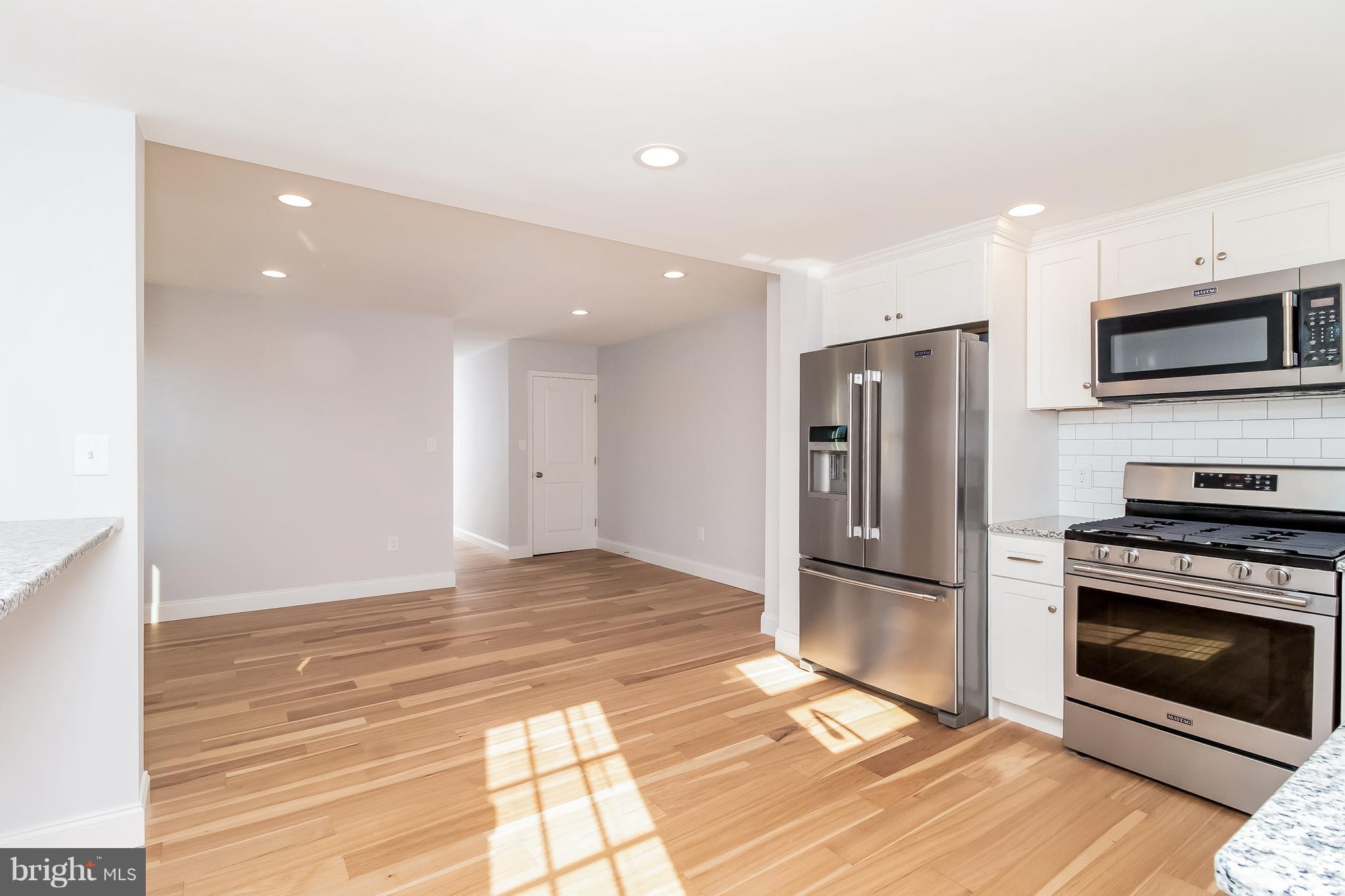 17 State Road, Unit B Media, PA 19063 - Photo 5 of 19 a kitchen with stainless steel appliances granite countertop a refrigerator and a stove top oven
