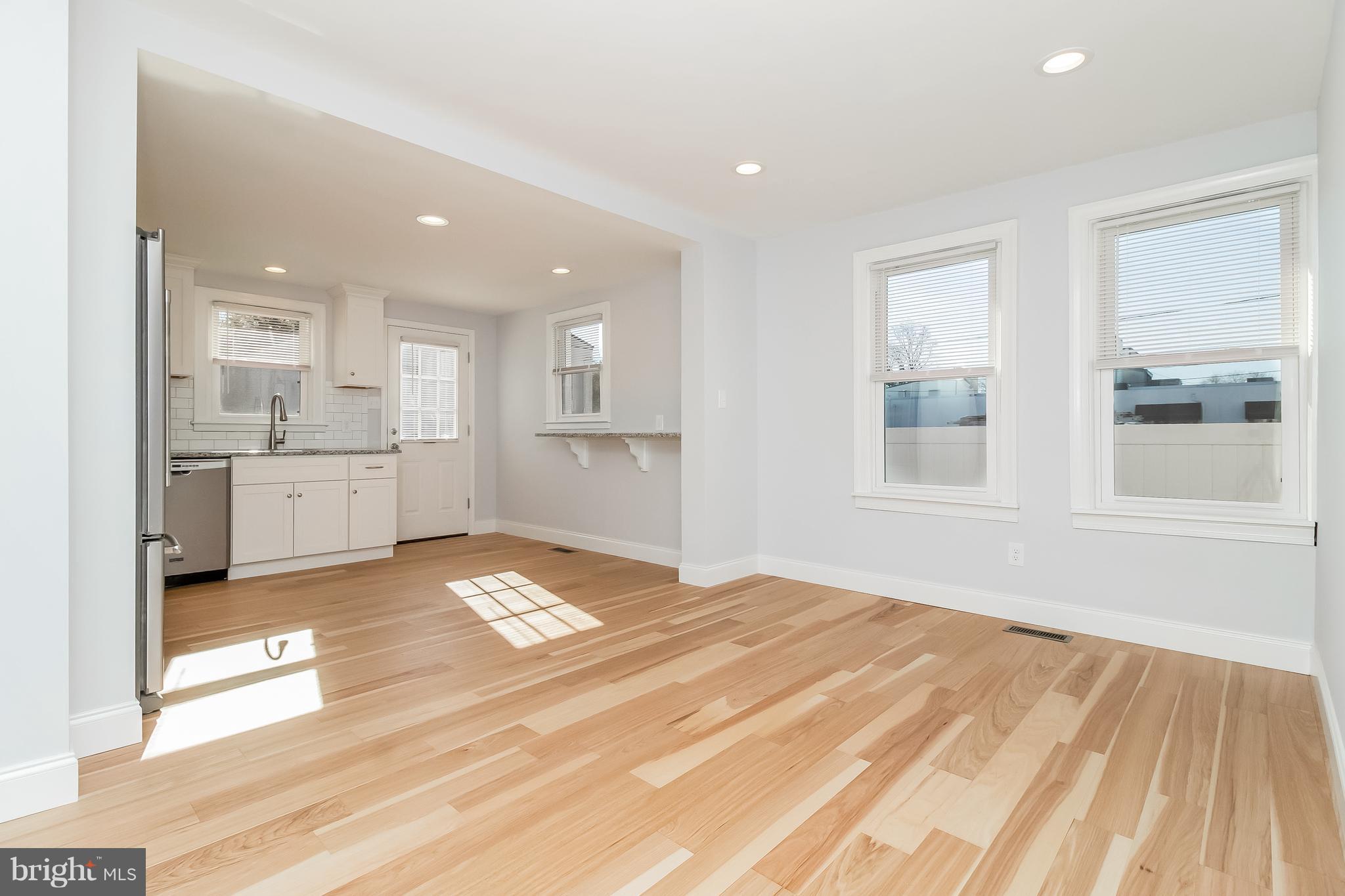 17 State Road, Unit B Media, PA 19063 - Photo 19 of 19 a view of kitchen and empty room with wooden floor
