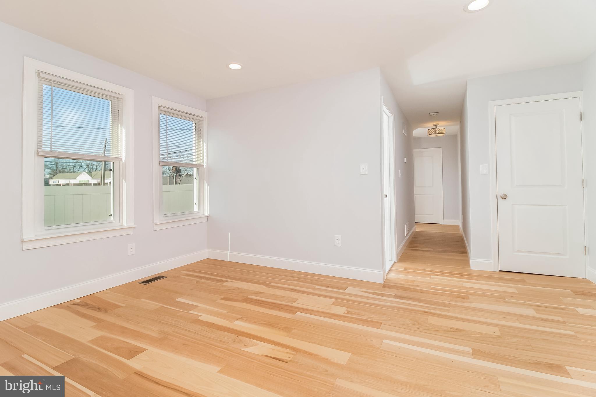 17 State Road, Unit B Media, PA 19063 - Photo 7 of 19 a view of an empty room with wooden floor and a window