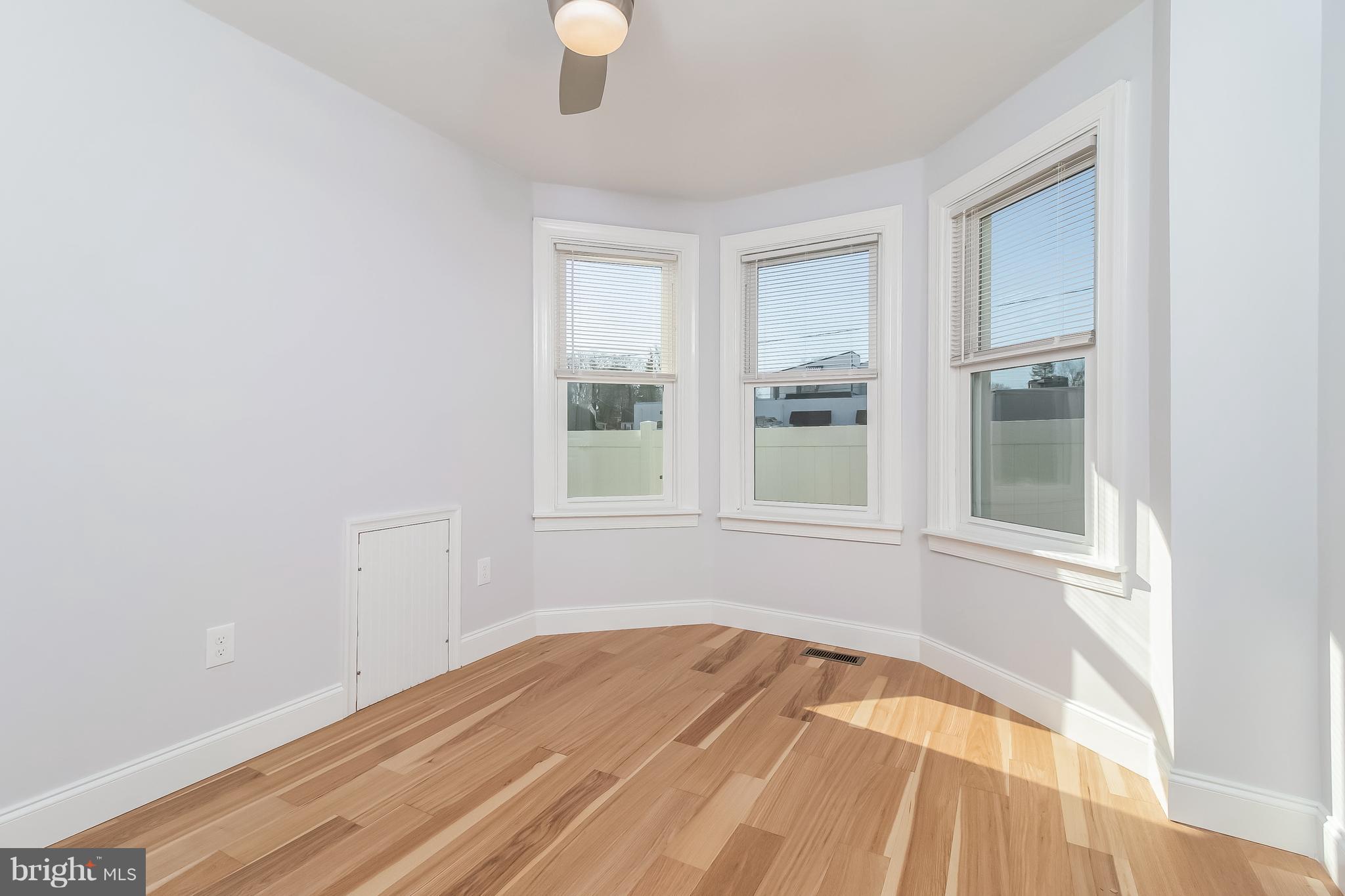 17 State Road, Unit B Media, PA 19063 - Photo 9 of 19 an empty room with wooden floor and windows