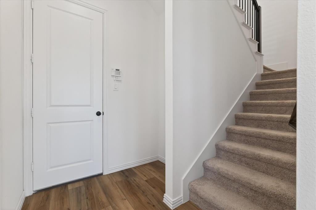 3038 Opera Way Sachse, TX 75048 - Photo 14 of 31 a view of entryway with wooden floor