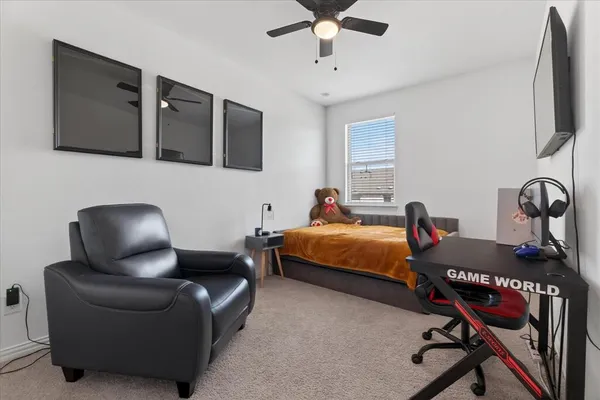 a bedroom with bed and tv