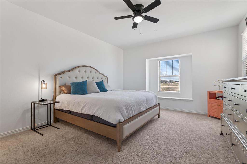 3038 Opera Way Sachse, TX 75048 - Photo 23 of 31 a bedroom with a bed and window