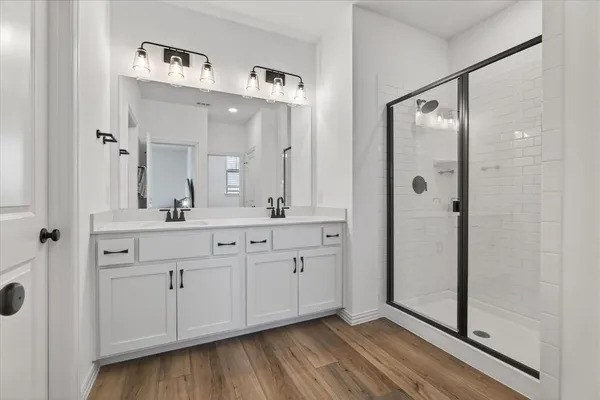 a view of a bathroom with wooden floor