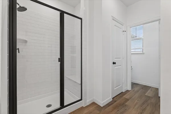 a spacious bathroom with a double vanity sink and mirror