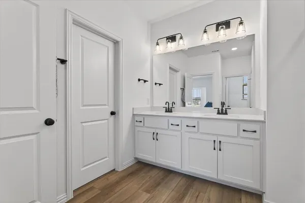 a white toilet sitting next to a shower