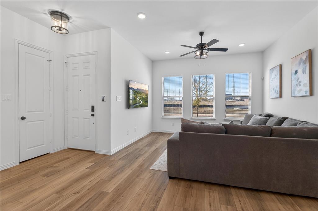 3038 Opera Way Sachse, TX 75048 - Photo 4 of 31 a living room with furniture and a window