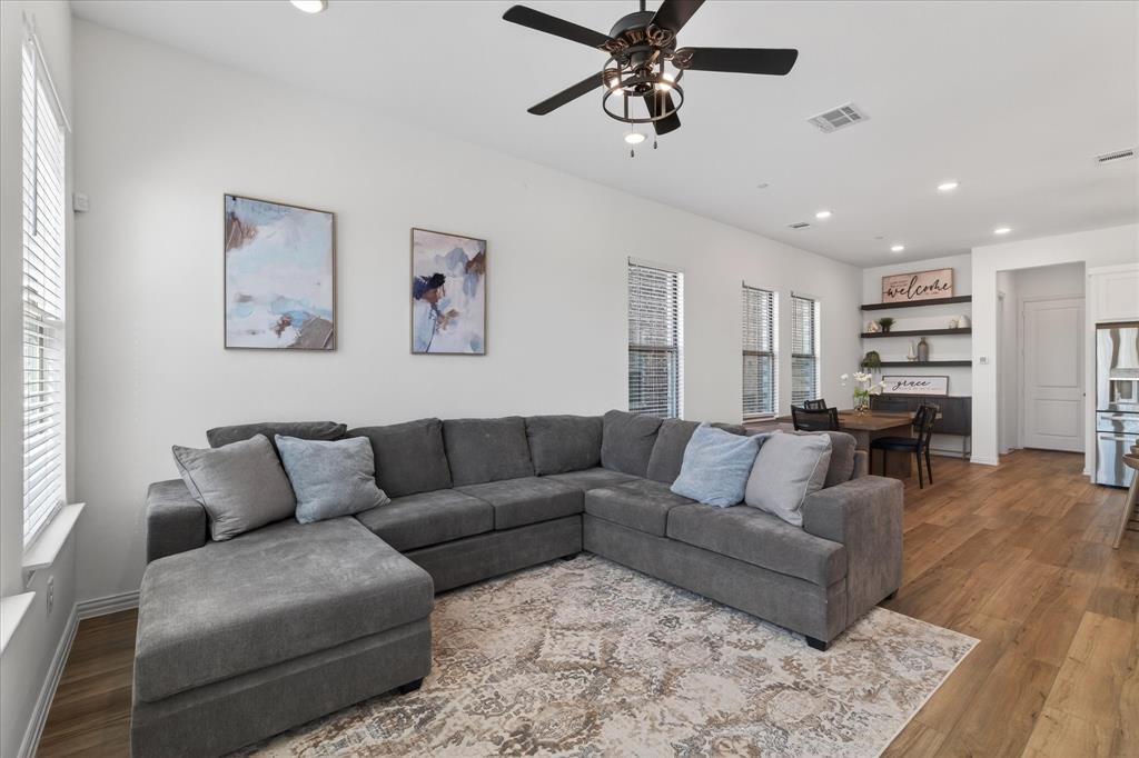 3038 Opera Way Sachse, TX 75048 - Photo 7 of 31 a living room with furniture and wooden floor