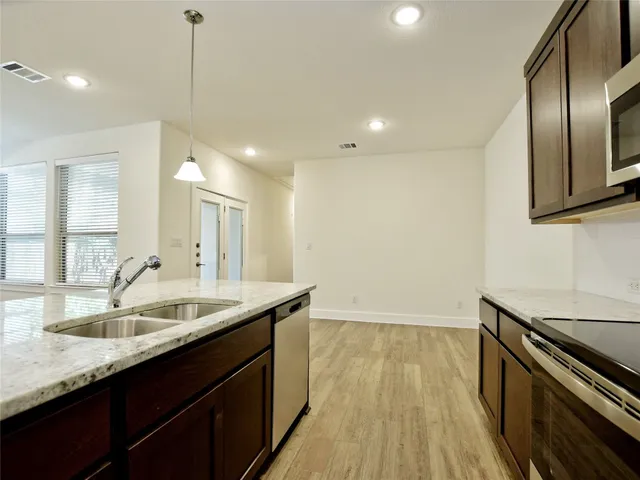 a bathroom with a sink double vanity granite and a mirror