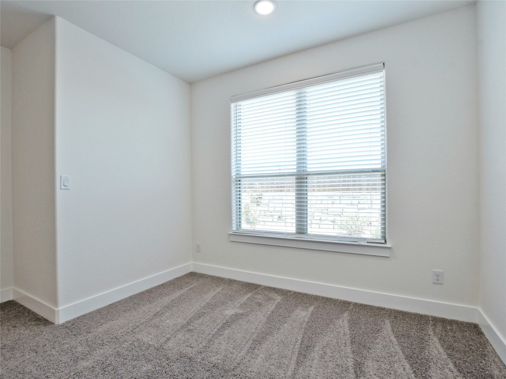 402 Parkline Drive, Unit 24A Georgetown, TX 78626 - Photo 18 of 27 an empty room with a window