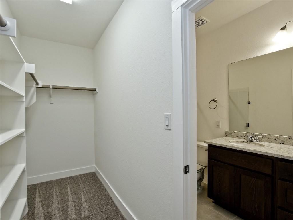 402 Parkline Drive, Unit 24A Georgetown, TX 78626 - Photo 19 of 27 a bathroom with a sink and a mirror