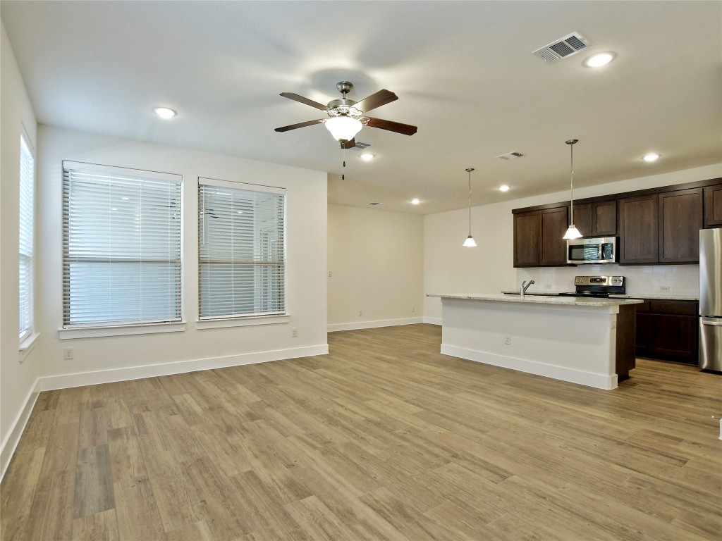 402 Parkline Drive, Unit 24A Georgetown, TX 78626 - Photo 6 of 27 a view of an empty room with window and cabinet