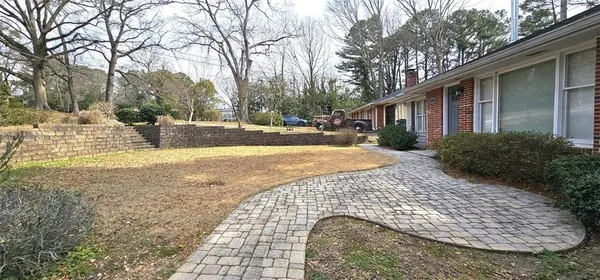 a view of a house with snow on the ground