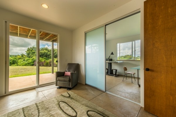 7561 Koolau Road, Unit B Kilauea, HI 96754 - Photo 13 of 25 a view of a livingroom with furniture and windows