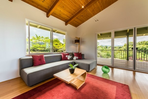7561 Koolau Road, Unit B Kilauea, HI 96754 - Photo 8 of 25 a living room with furniture and a large window