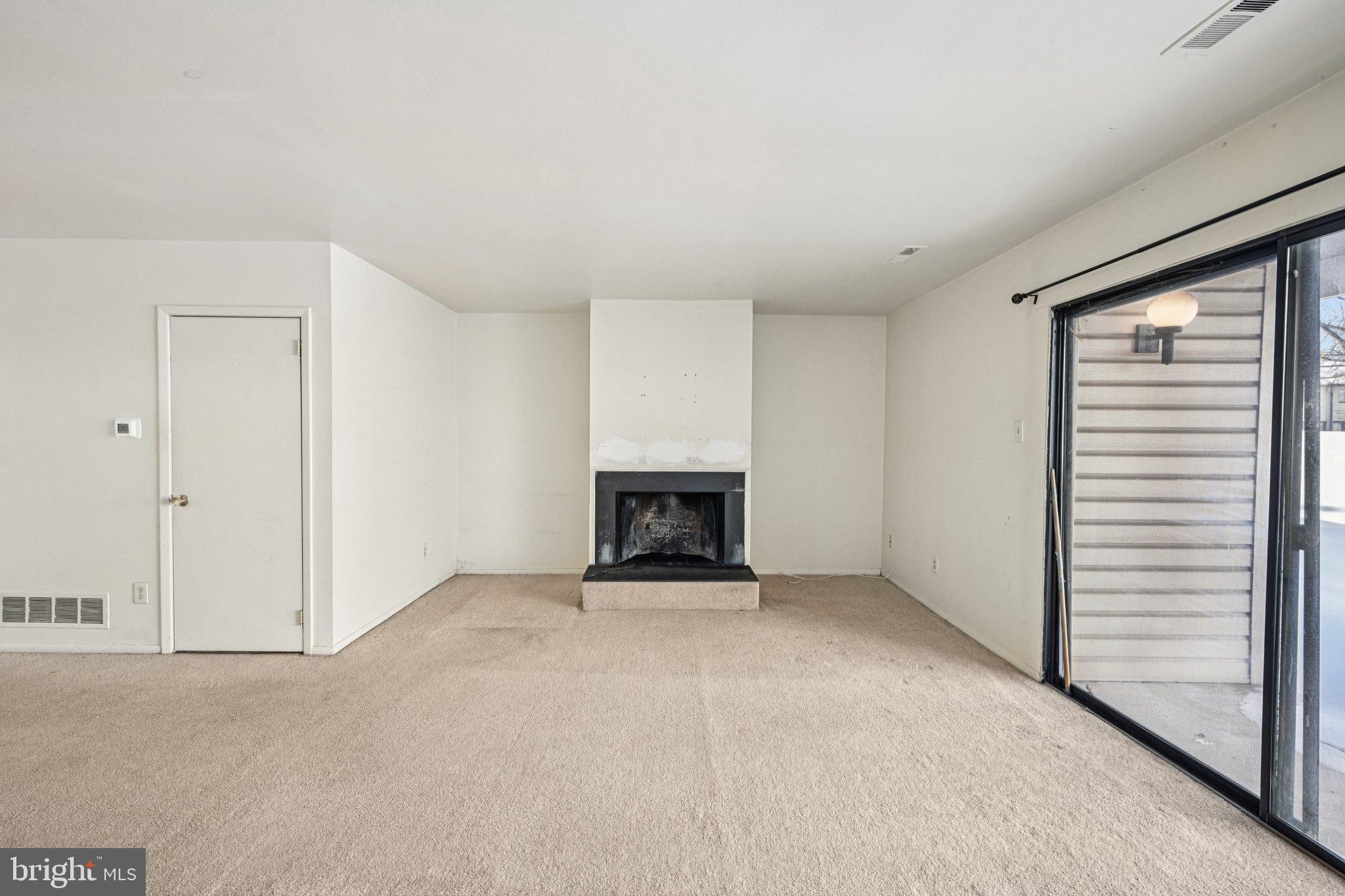 50 Centennial Road Telford, PA 18969 - Photo 9 of 38 Spacious living area with cozy fireplace.