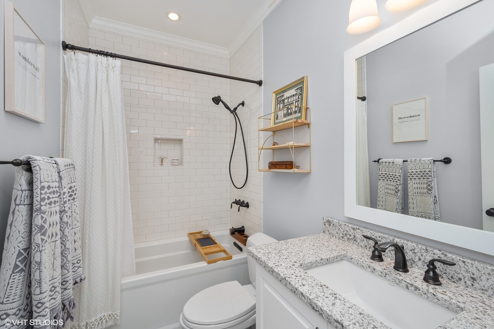 220 West Scott Street, Unit F Chicago, IL 60610 - Photo 12 of 19 a bathroom with a granite countertop sink toilet and shower