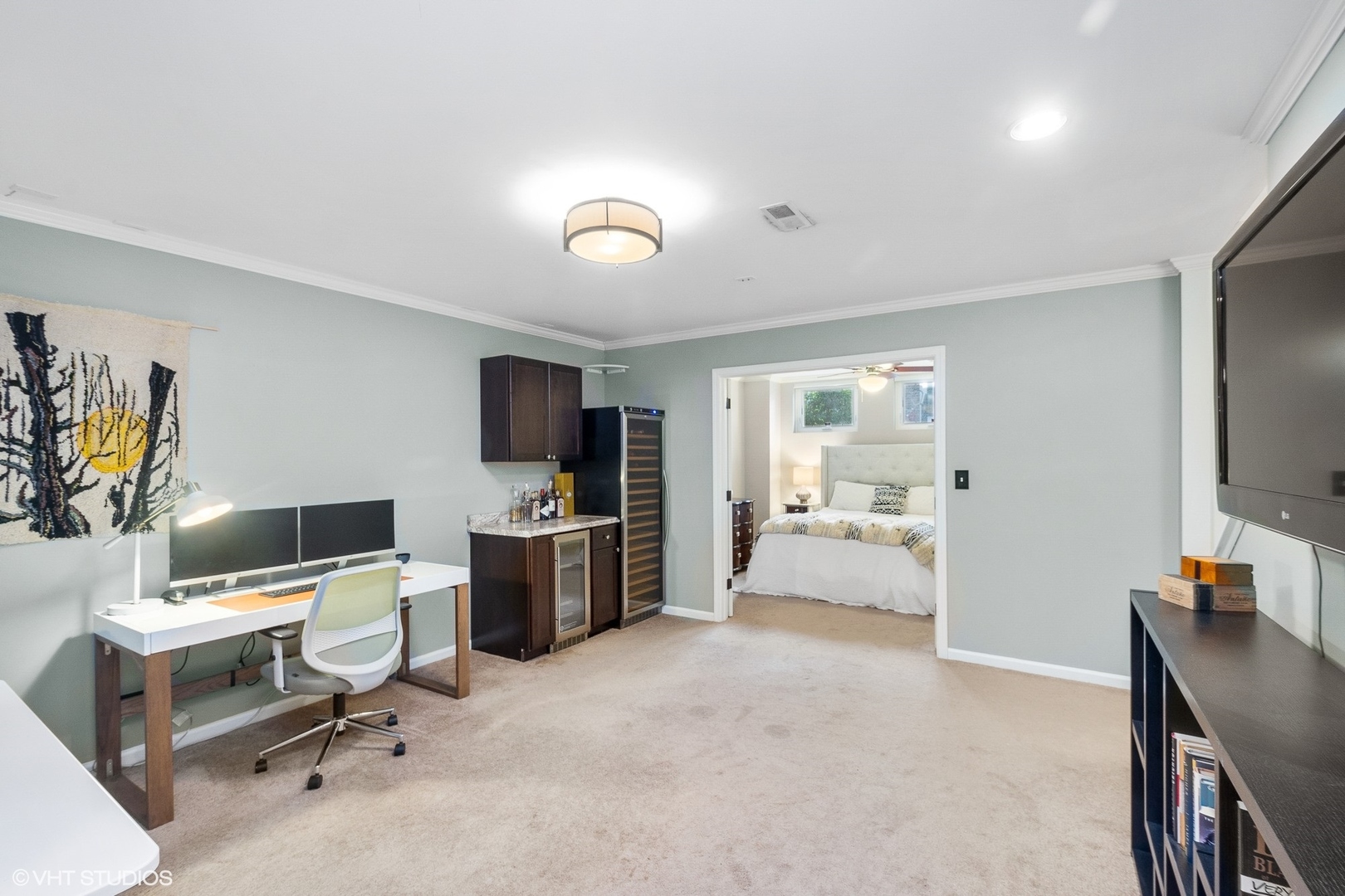 220 West Scott Street, Unit F Chicago, IL 60610 - Photo 14 of 19 a view of a workspace with furniture and a flat screen tv