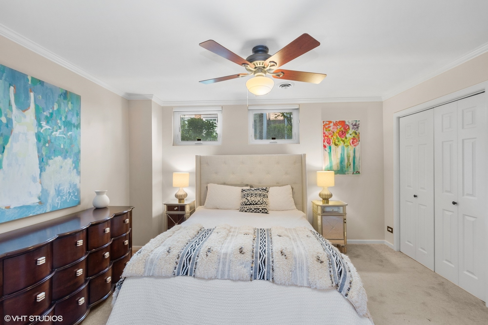 220 West Scott Street, Unit F Chicago, IL 60610 - Photo 15 of 19 a bedroom with a bed and a chandelier