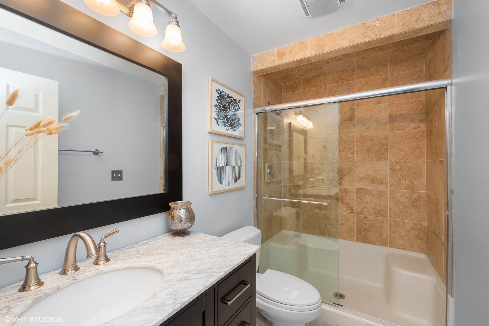 220 West Scott Street, Unit F Chicago, IL 60610 - Photo 16 of 19 a bathroom with a granite countertop sink toilet and shower