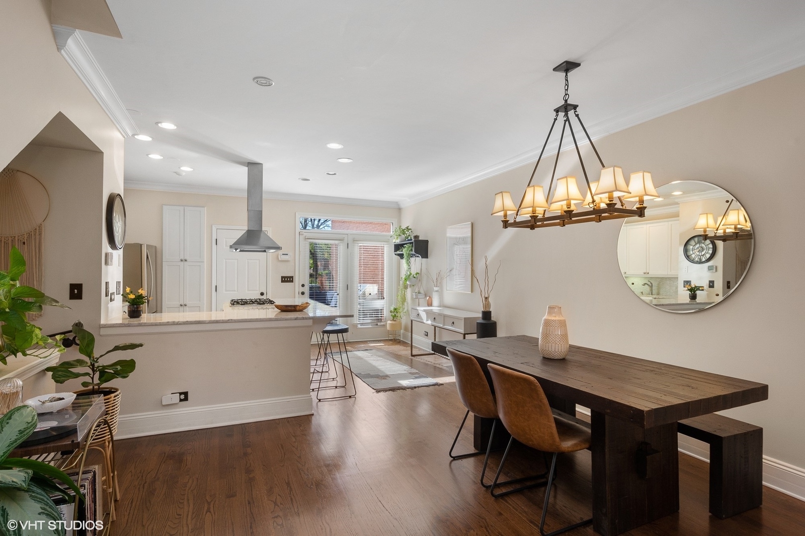 220 West Scott Street, Unit F Chicago, IL 60610 - Photo 6 of 19 a view of a dining room with furniture wooden floor and chandelier