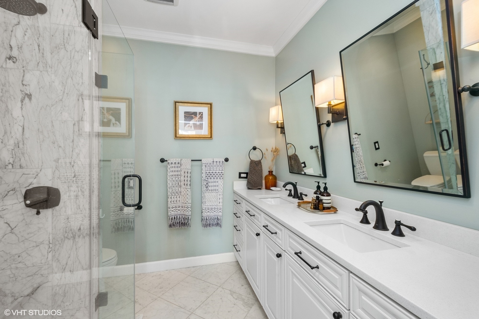 220 West Scott Street, Unit F Chicago, IL 60610 - Photo 8 of 19 a bathroom with double vanity sink and mirror