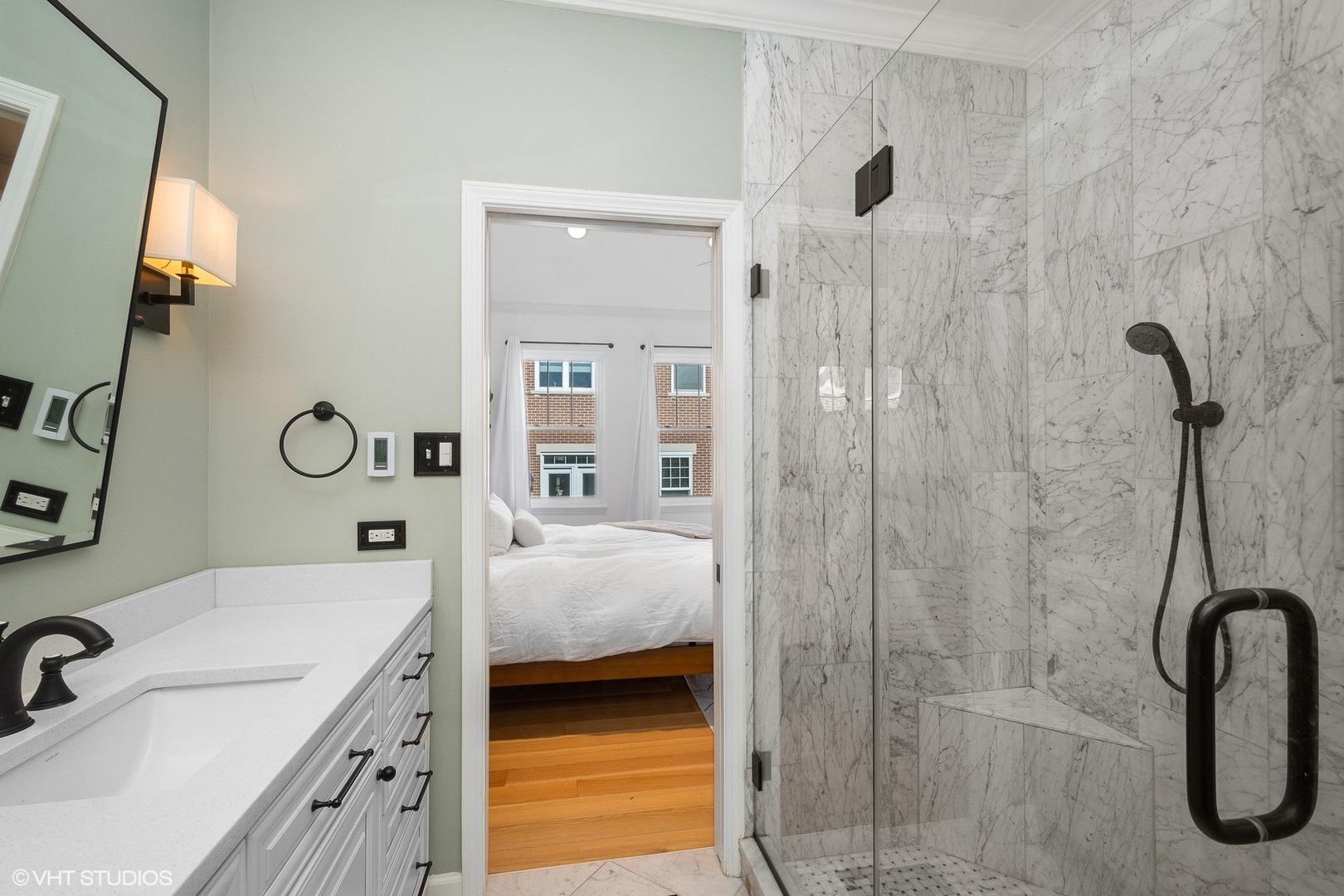 220 West Scott Street, Unit F Chicago, IL 60610 - Photo 9 of 19 a en suite bathroom with a granite countertop sink and a mirror