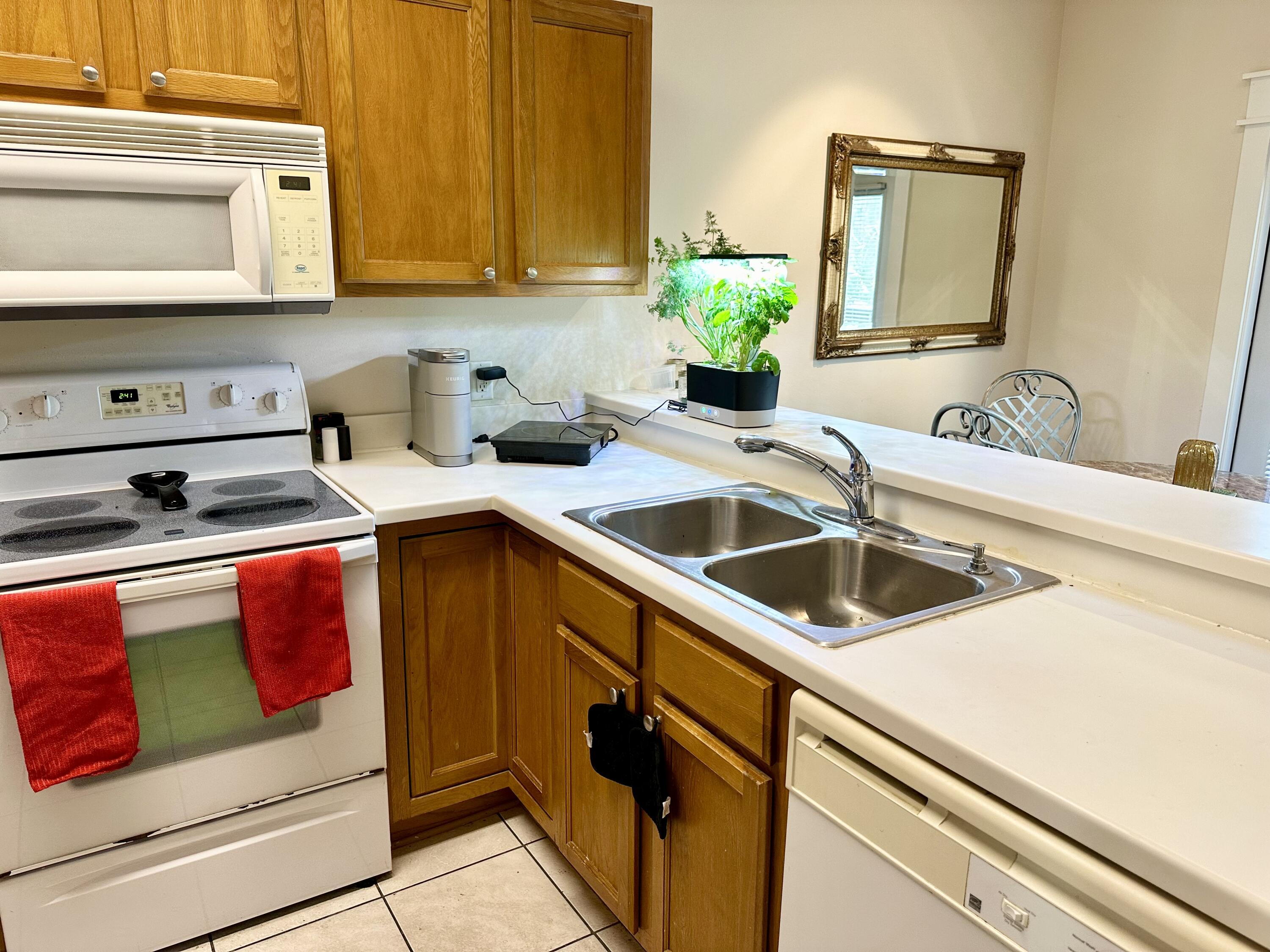 732 East Mack Bayou Drive, Unit 2 Santa Rosa Beach, FL 32459 - Photo 15 of 43 a kitchen with stainless steel appliances granite countertop a sink and a stove