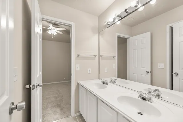 a bathroom with a sink and mirror