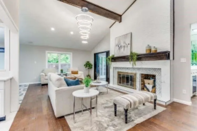 a living room with furniture and a fireplace