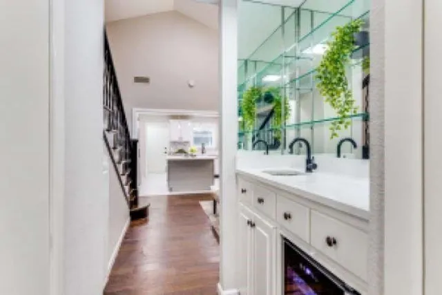 a en suite bathroom with a sink a mirror and shower