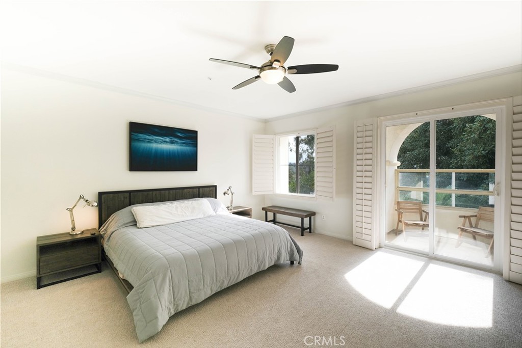 3 Avenida Cristal San Clemente, CA 92673 - Photo 15 of 36 a bedroom with a bed and a chandelier
