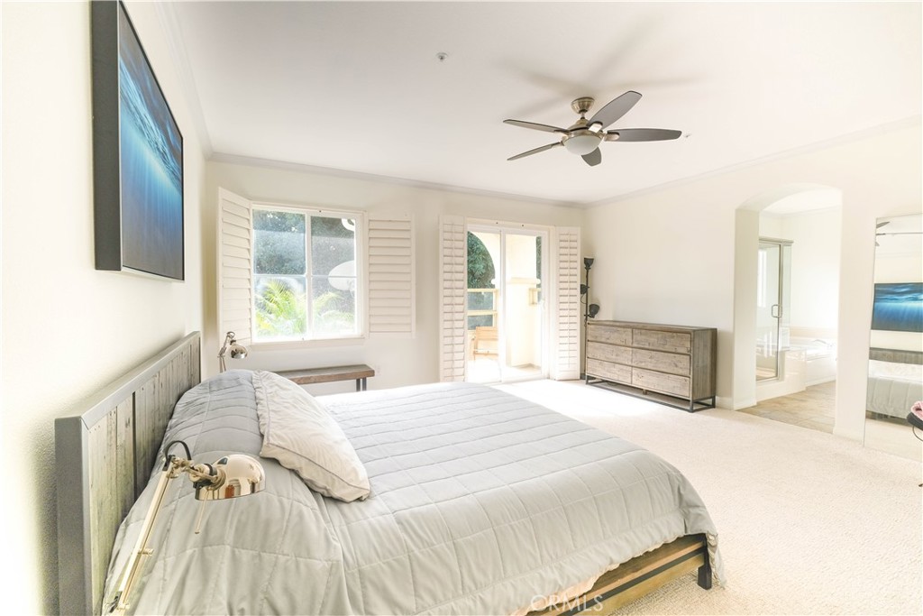 3 Avenida Cristal San Clemente, CA 92673 - Photo 17 of 36 a bedroom with a bed dresser and a large window