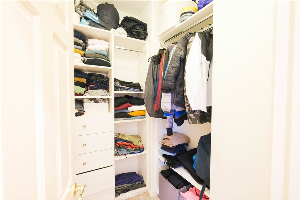 3 Avenida Cristal San Clemente, CA 92673 - Photo 22 of 36 a view of walk in closet with clothes and shoes