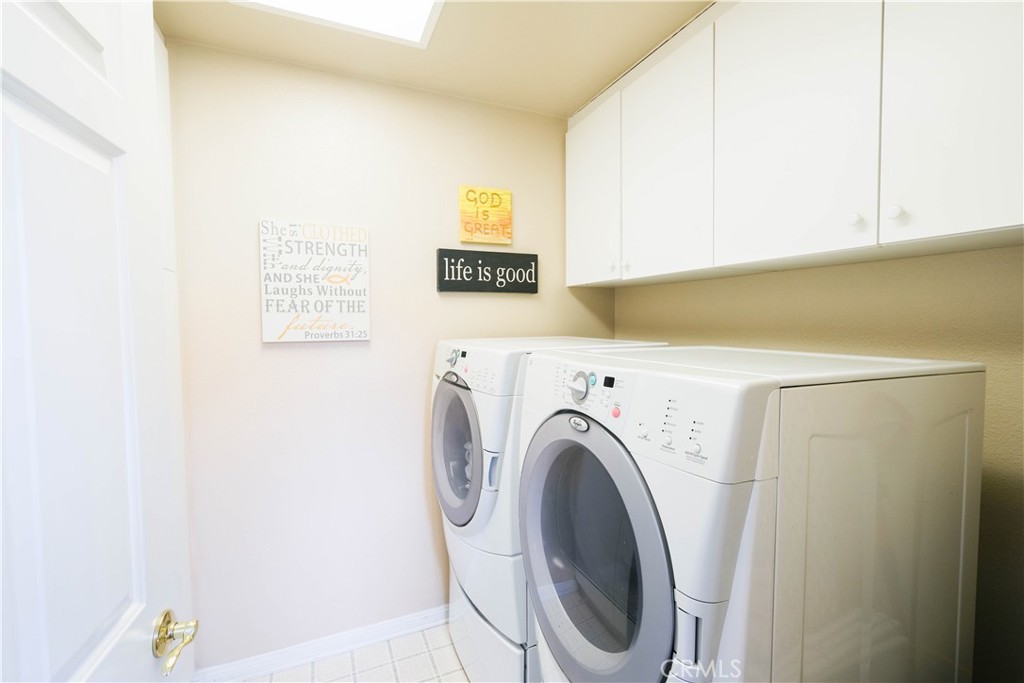 3 Avenida Cristal San Clemente, CA 92673 - Photo 23 of 36 a utility room with dryer and washer